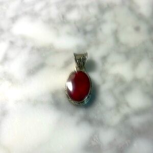 Oval large ruby pendant in sterling silver